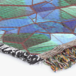 緑と青の不規則なモザイクが重ねられた乱雑な スローブランケット