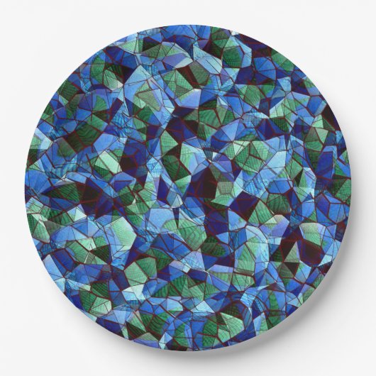 緑と青の不規則なモザイクが重ねられた乱雑な ペーパープレート (正面)