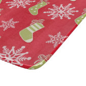 緑のクリスマスのストッキングおよび雪片 カッティングボード (角)