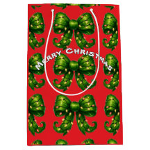 緑のクリスマスリボン模様の赤いギフトバッグ
