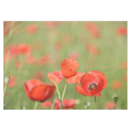 緑のケシの鮮やかで赤いケシは守備につきます テーブルクロス