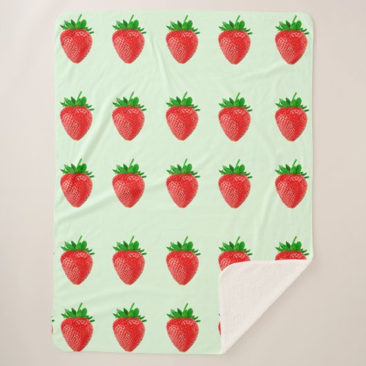 緑のシャーブルケットの上のイチゴ シェルパブランケット (正面)