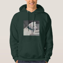 緑のスカーフを巻いたかわいい白い子犬