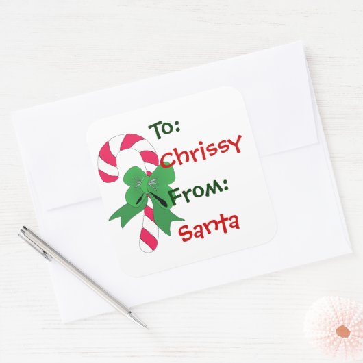 緑のリボンが付いているクリスマスのギフトのラベルのキャンディ・ケーン スクエアシール (封筒)