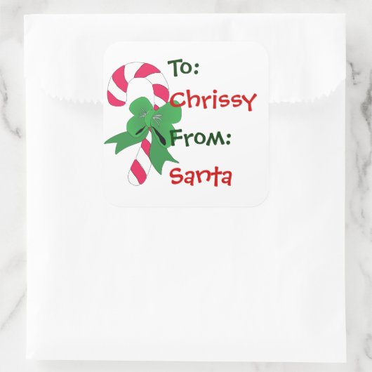 緑のリボンが付いているクリスマスのギフトのラベルのキャンディ・ケーン スクエアシール (バッグ)