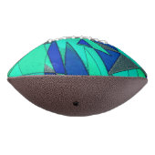 緑の三角形の切り出し、青い背景、粗い アメリカンフットボール (回転270)