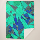 緑の三角形の切り出し、青い背景、粗い シェルパブランケット (正面)