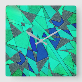 緑の三角形の切り出し、青い背景、粗い スクエア壁時計