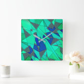 緑の三角形の切り出し、青い背景、粗い スクエア壁時計 (ホーム)