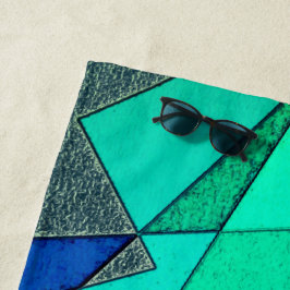 緑の三角形の切り出し、青い背景、粗い ビーチタオル