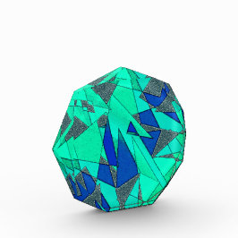 緑の三角形の切り出し、青い背景、粗い フォトブロック