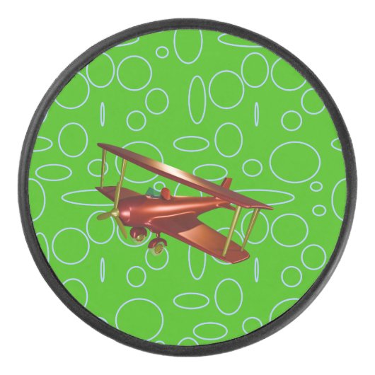 緑の円とループ上の赤い飛行機 アイスホッケーパック (正面)