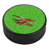 緑の円とループ上の赤い飛行機 アイスホッケーパック (3/4)