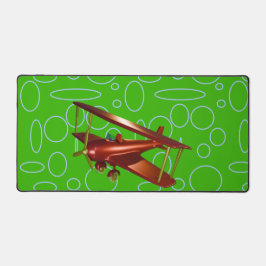 緑の円とループ上の赤い飛行機 デスクマット