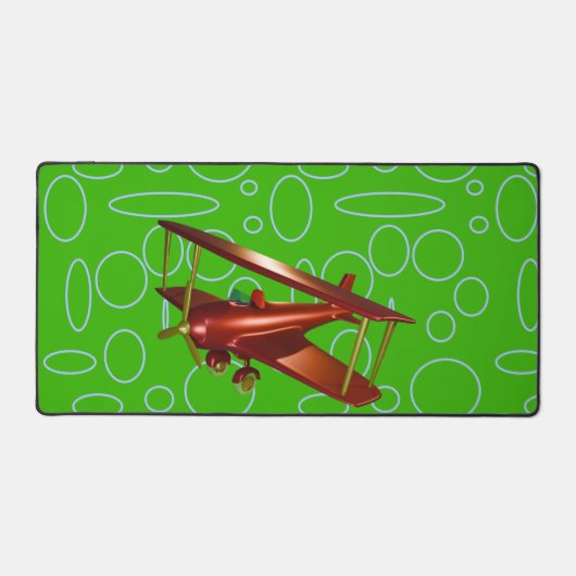 緑の円とループ上の赤い飛行機 デスクマット (正面)