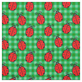 緑の格子模様のケージの上にかわいい赤いテンジウムシ ファブリック (見本)