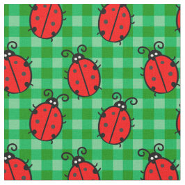 緑の格子模様のケージの上にかわいい赤いテンジウムシ ファブリック