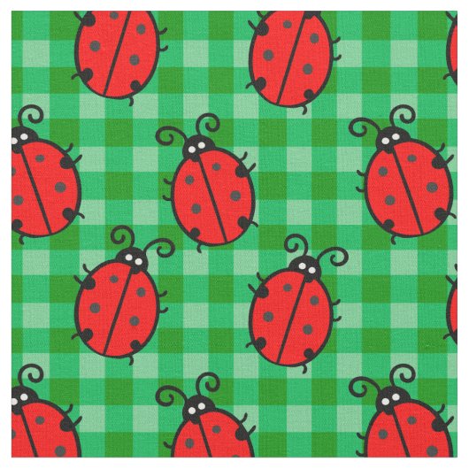 緑の格子模様のケージの上にかわいい赤いテンジウムシ ファブリック (クローズアップ)