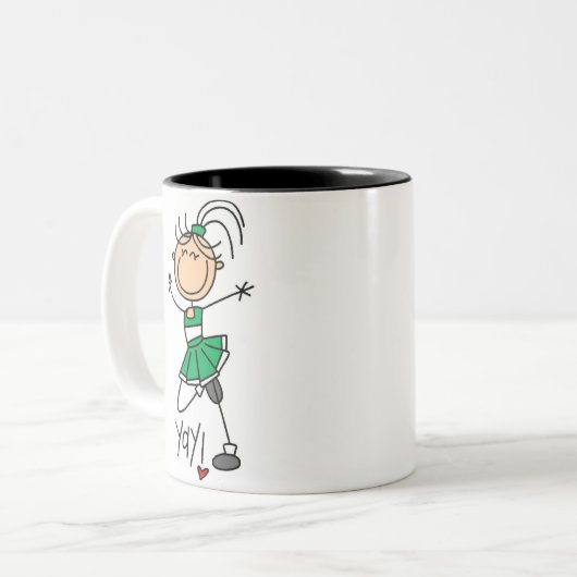 緑の棒の姿のチアリーダーのTシャツおよびギフト ツートーンマグカップ (正面左)