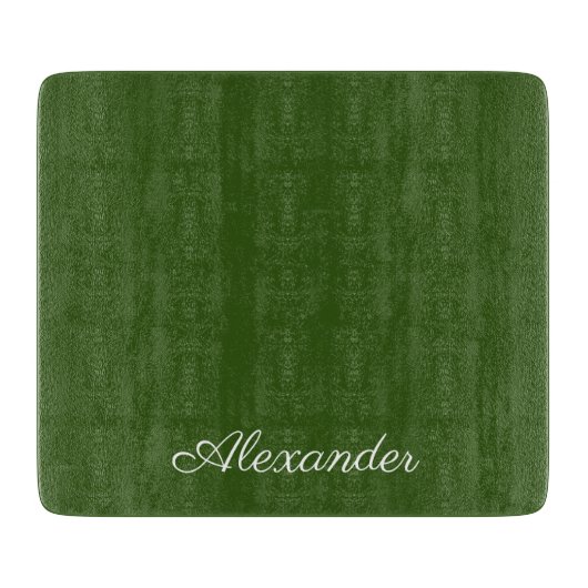 緑の無地の背景の白いスクリプト カッティングボード (正面)