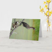 緑の狩人：緑のアオサギが時計を カード (黄色い花)