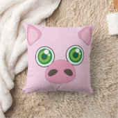 緑の瞳のピンクの枕を持つかわいいブタ クッション (ブランケット)