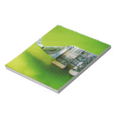 緑の背景にドル紙幣の折り紙ゾウ ノートパッド (回転)