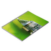 緑の背景にドル紙幣の折り紙ゾウ ノートブック (左側)