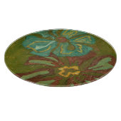 緑の背景に水色と焦げたオレンジ色の花 カッティングボード (角)