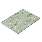 緑の背景に赤と黄色の小さな花模様 ノートブック (左側)