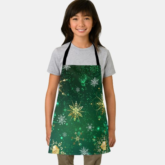 緑の背景に金のクリスマスの雪の結晶 エプロン (インサイチュ)