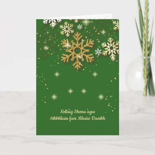 緑の背景に金の雪の結晶が舞うアイルランドのクリスマスカード シーズンカード (正面)