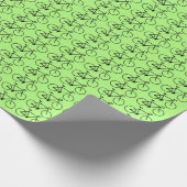 緑の背景に黒い自転車のアイコンが多い ラッピングペーパー (角)