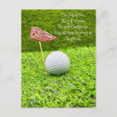 緑の草の上にゴルフボールを持つゴルフクリスマス シーズンポストカード (正面)