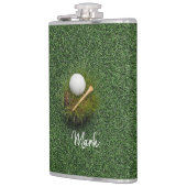 緑の草の上のゴルフボール フラスク (左)