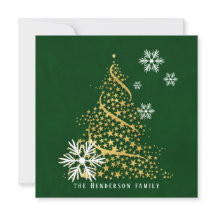 緑の雪の上の星の黄金のクリスマスツリー