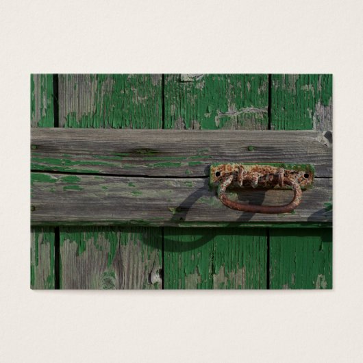 緑ドアの錆びたドアハンドル (正面)