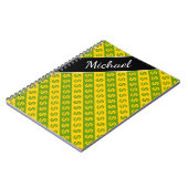 緑及び黄色のドル記号($)の縞模様 ノートブック (左側)