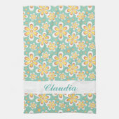 緑色に可愛いオレンジ色の花をモノグラム キッチンタオル (縦)