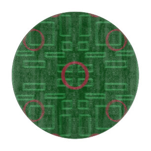 緑色のカッティングボード上のジオメトリックボックス カッティングボード