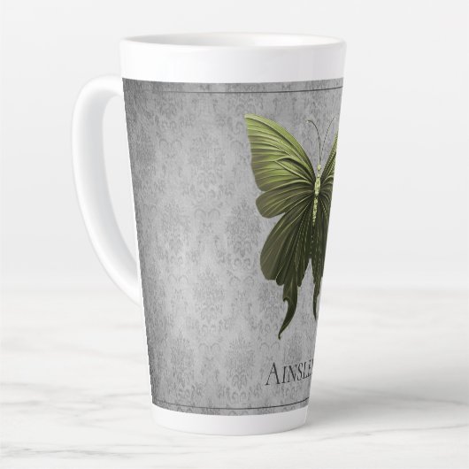 緑色の宝石を付けた蝶 カフェラテマグ (左アングル)