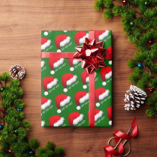 緑色の背景にHOHOHOと書かれた赤いサンタの帽子 ラッピングペーパー (クリスマスギフト)