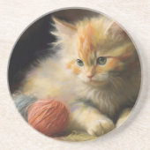 編み糸でオレンジ遊色の子猫を起こす コースター (正面)