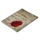 美しい赤いバラの音楽のノートは色あせたピアノを渦巻く ノートブック (左側)