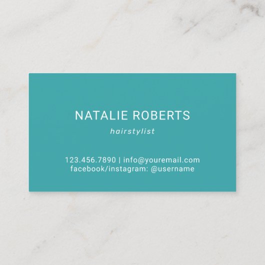 美容師ティール（緑がかった色）羽根金ゴールドシザー赤面サロン 名刺 (裏面)