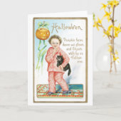 老ファッションドハロウィーン、黒猫を抱えた少年 カード (黄色い花)