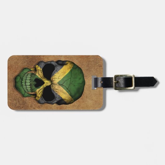 老化させ、擦り切れたなジャマイカの旗のスカル ラゲッジタグ (正面横)