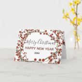 聖降誕祭の赤い漿果のお目出とう カード (黄色い花)