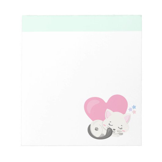 背中に大きなハートを背負って眠る甘い子ネコ ノートパッド (正面)