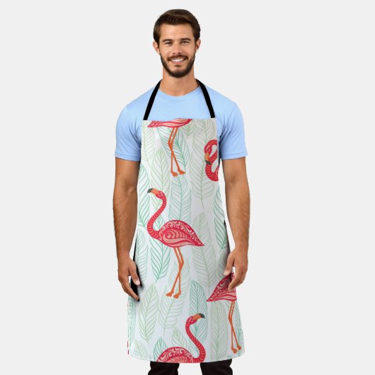 背景にピンクのフラミンゴのオーナメントを付けた模様 エプロン (着用した状態)